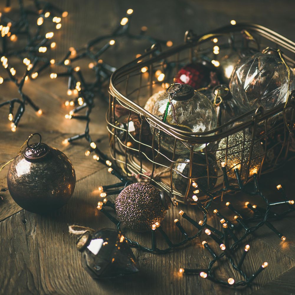 Christmas tree decorations in wire box, with garland, square crop