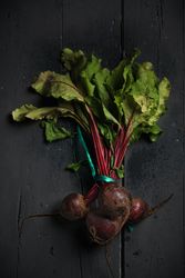 Bunch of raw beetroot with edible taproots and leaves