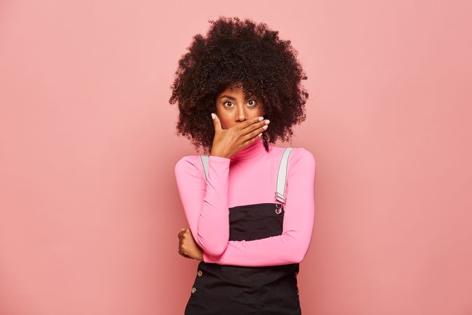 Shocked Black woman looking at camera