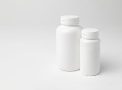 Mockup of two closed plastic medicine bottles, with copyspace, perfect for design mockups