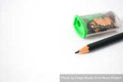 Sharpened pencil next to sharpener on table with copy space 5oDqLm