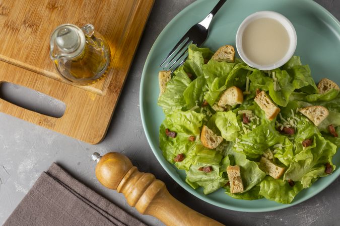 Caesar salad with croutons and bacon.