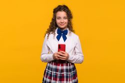 Girl holding red smartphone, smiling confidently
