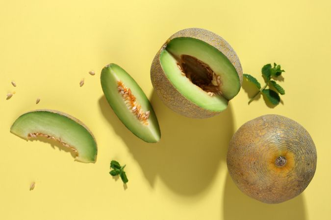 Top View Sliced Melon on Yellow Background