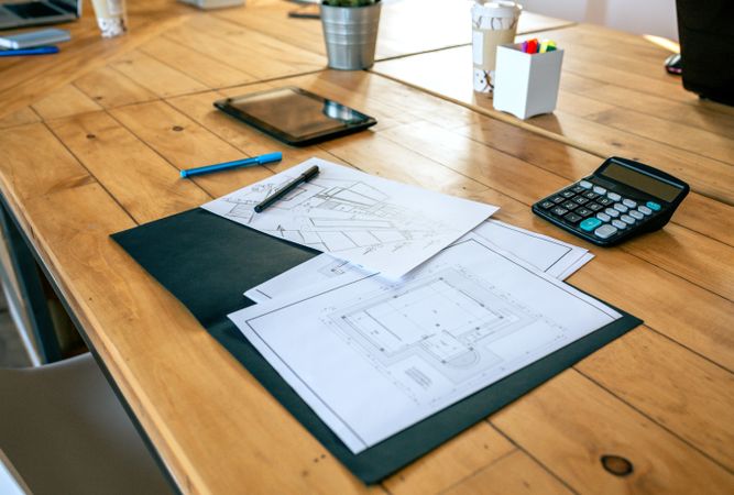 Workplace of an architect with blueprints and sketches