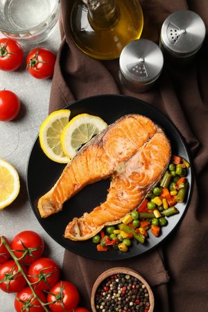 Composition with tasty grilled salmon on gray background, top view