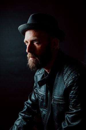 Young bearded guy in leather jacket