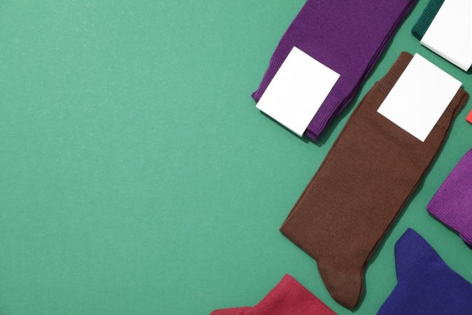 Multicolored high socks on a green background.