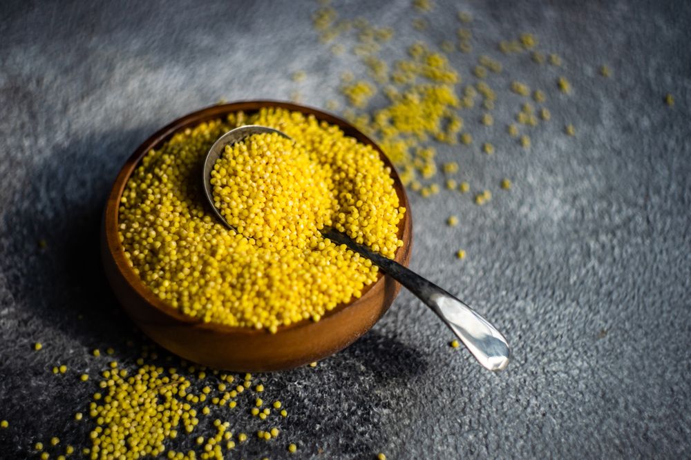 Bowl of millet grain with spoon