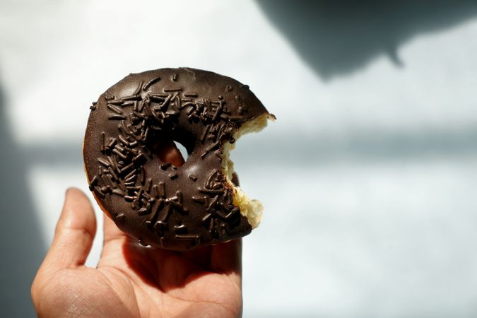 Chocolate donut with bite taken out