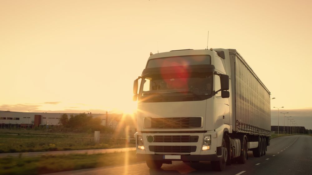 Front-View of Semi-Truck with Cargo Trailer Driving on a Highway.