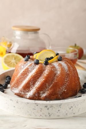 Cake with powder sugar and lemon, space for text