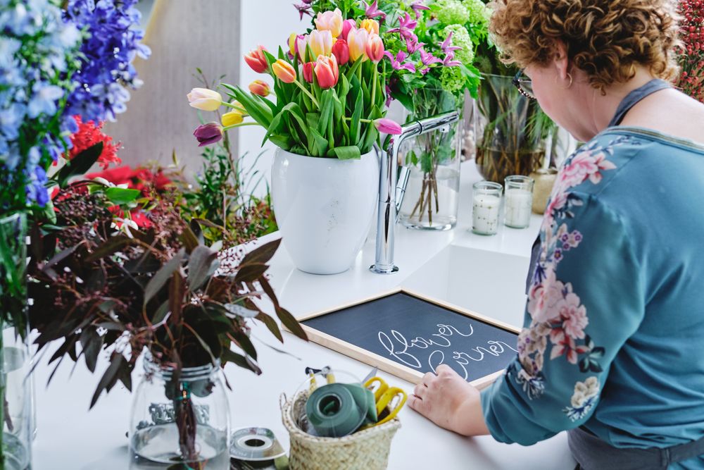 Unrecognizable woman working in floral shop