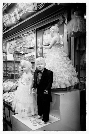 B&W shot of child mannequins in formal wear