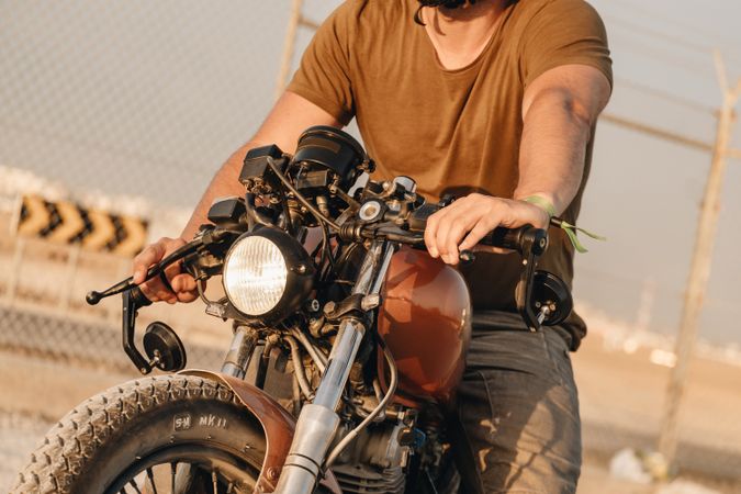 Strong man driving motorcycle