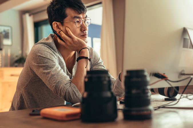 Photographer reviewing photos on computer screen