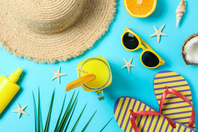 Flat lay composition with summer vacation accessories on color background, closeup and top view. Happy holidays