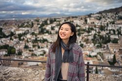 Cheerful woman visiting ancient city