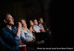 Group of people in movie theater enjoying a film 0gGP70
