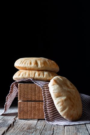 Pita bread on wooden table
