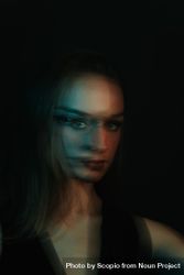 Blurry portrait of woman in UV light bDMaJ0