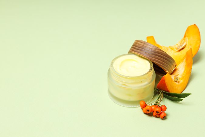 Skin care and face care concept - pumpkin cosmetic