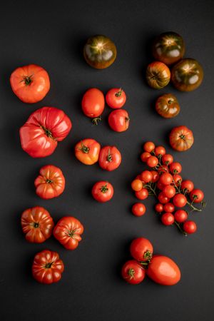 from above view of tomatoes on a dark surface