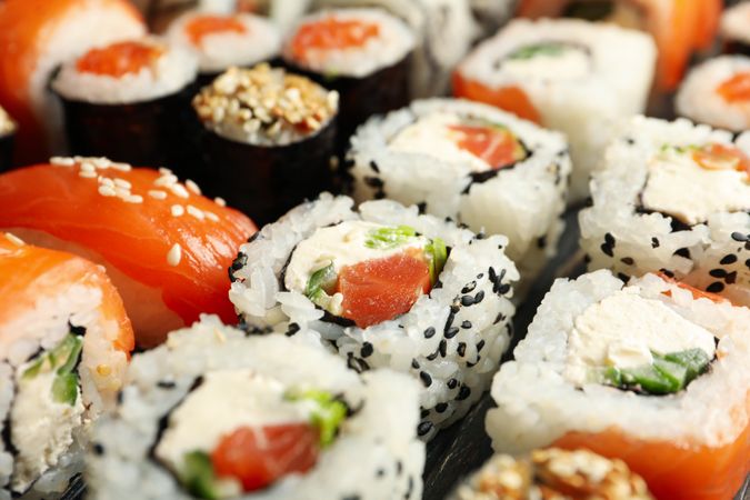 Delicious sushi rolls on wooden background, close up Japanese food