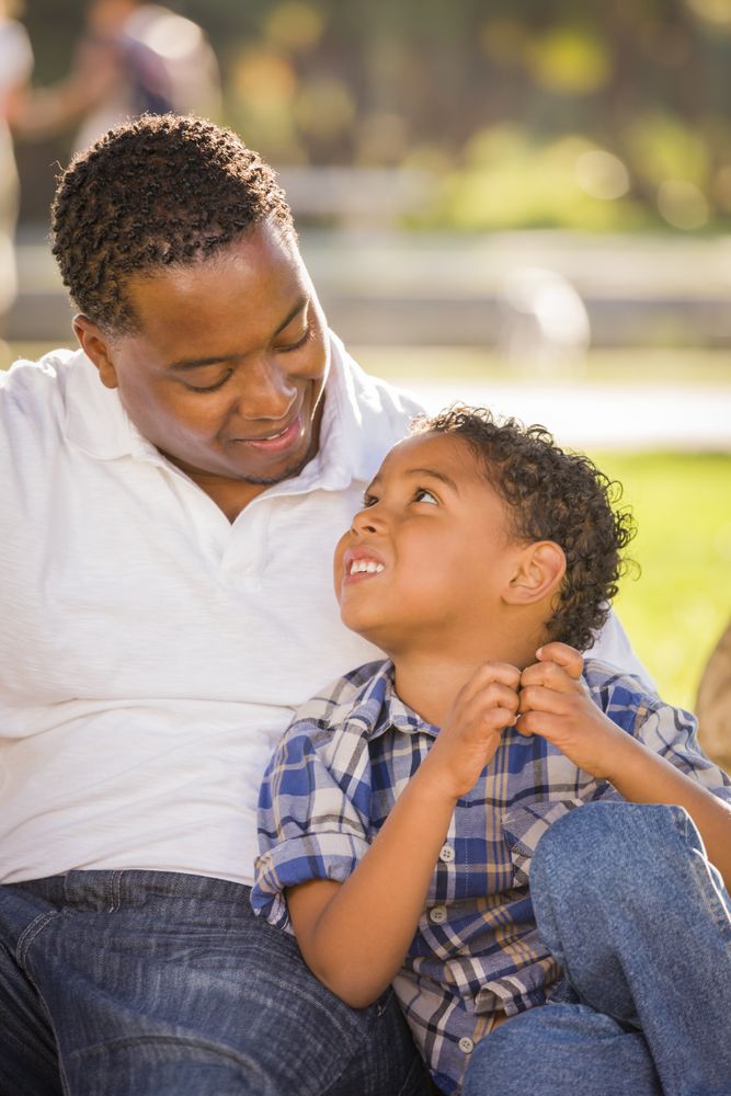 Content Father and Son Sitting Outside