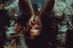 Woman lying on ground