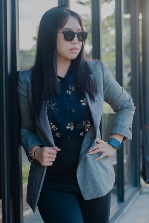 Confident Asian Woman in Smart Casual Attire Posing Outdoors