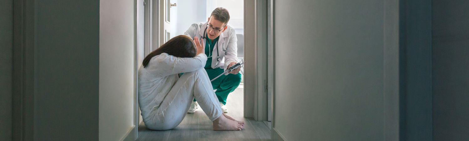 Doctor trying to help patient who refuses help