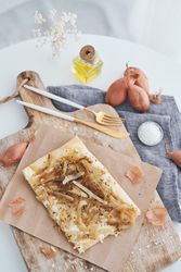 Delicious baked onion tart with cutlery