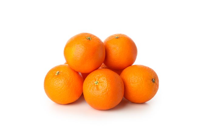 Group of ripe mandarins isolated on light background