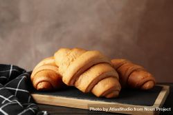 Side view of pastries on breadboard, copy space 4ZWyOb