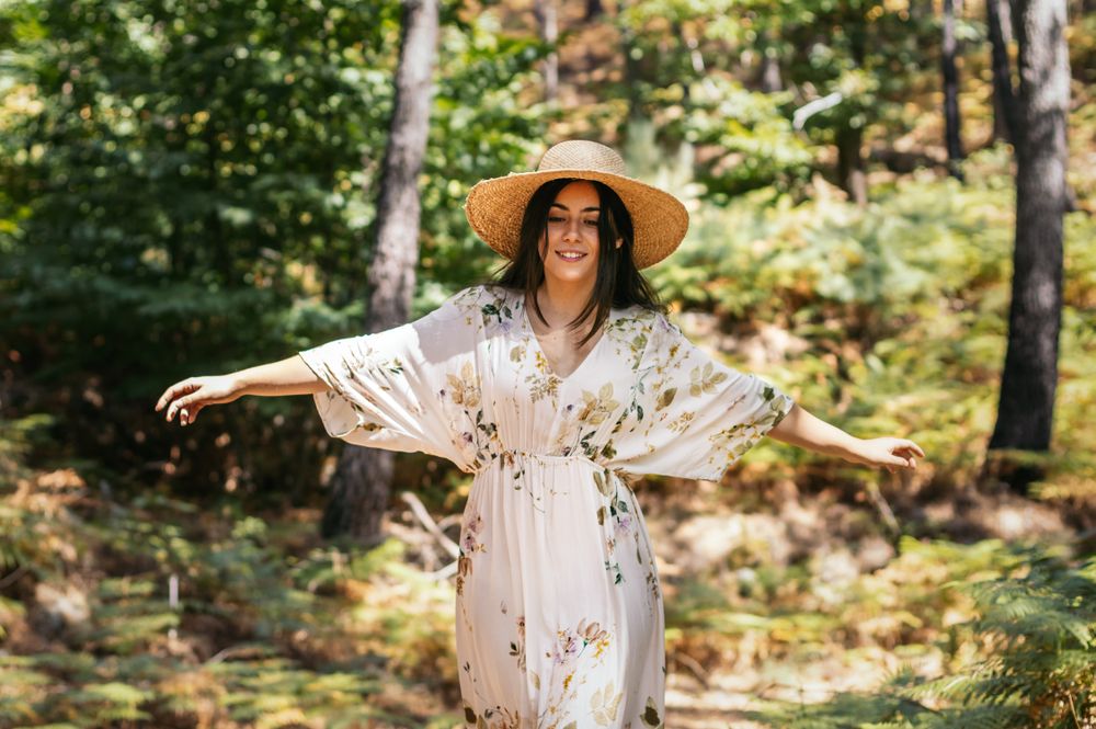 young woman walking in the forest