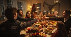 Christmas Dinner Together with Happy Parents, Children and Friends at Home.