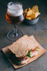 Delicious sandwich with ham, cheese, lettuce and tomato