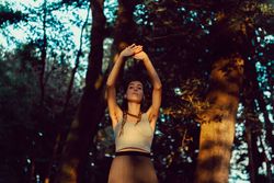 Young woman in majestic forest