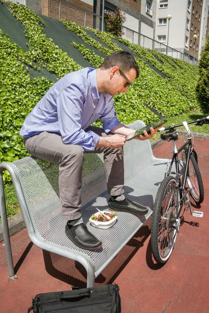 Young business man working with electronic tablet in lunch break