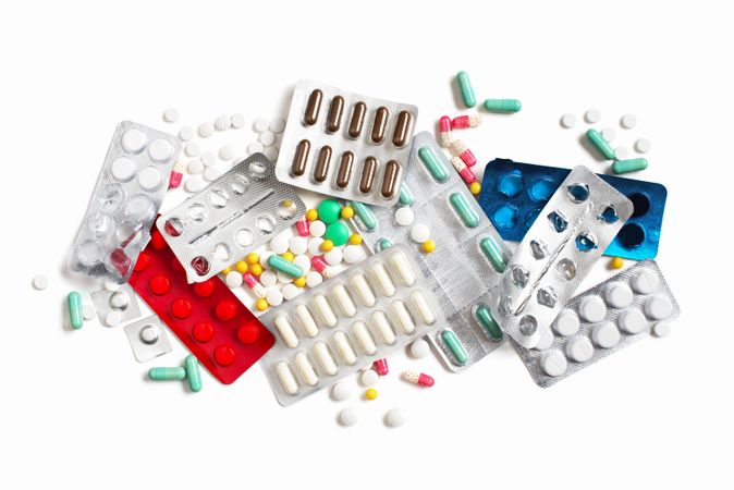 Pill capsules on plain background