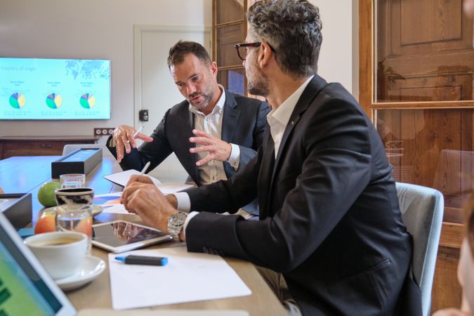 Businessmen sharing ideas during meeting