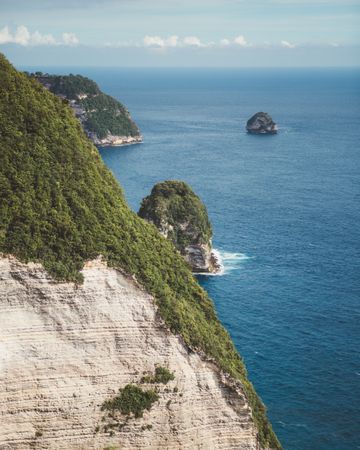 picturesque ocean landscape with green cliffs on shore, Bali