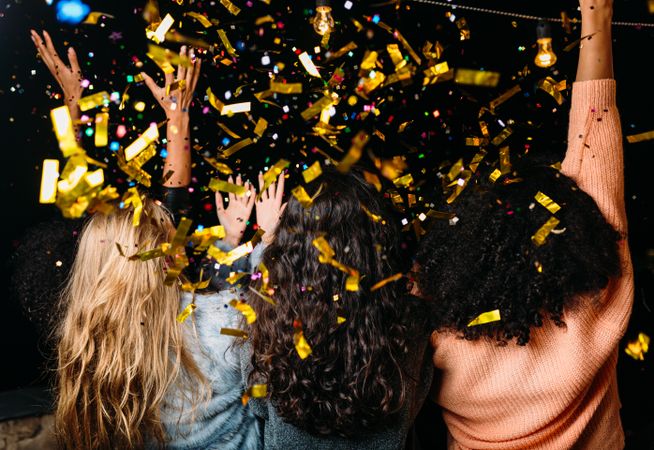 Rear view of woman at party with confetti