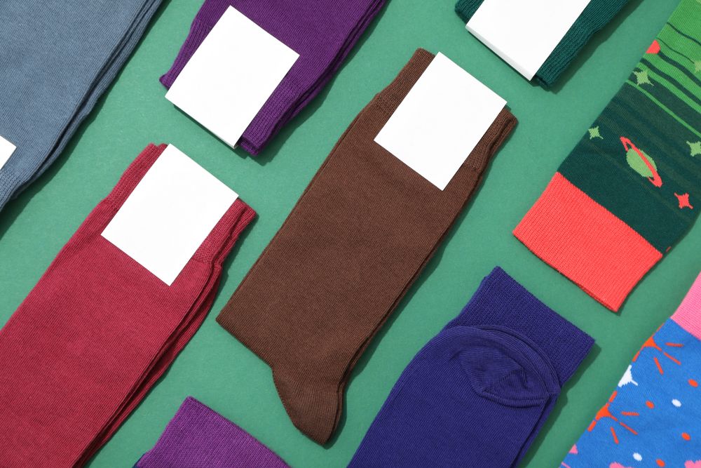 Multicolored high socks on a green background.