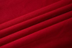 Folded Red fabric background texture.