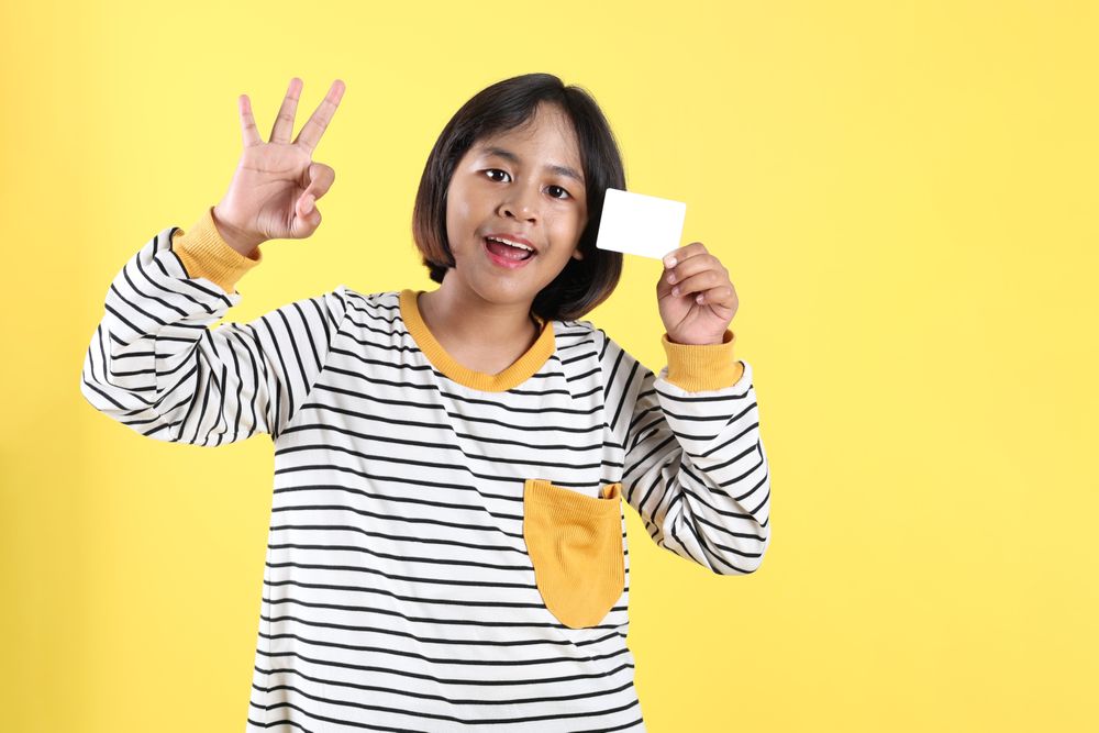 Asian Kids Holding Empty Bank Card with OK Sign