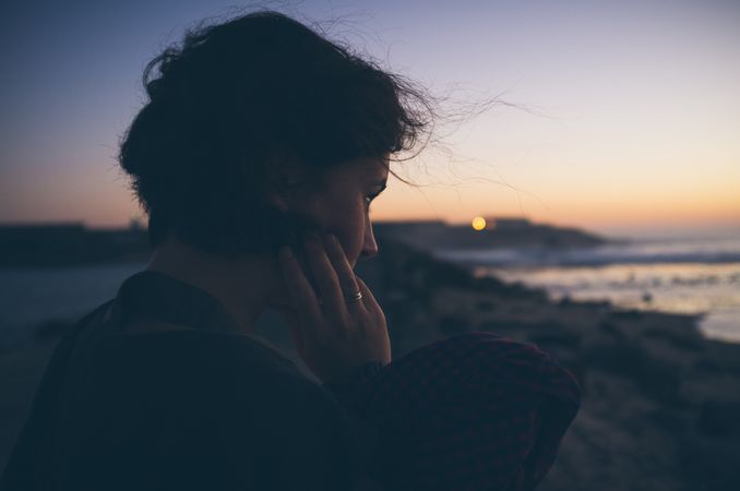 Beautiful female near waving sea