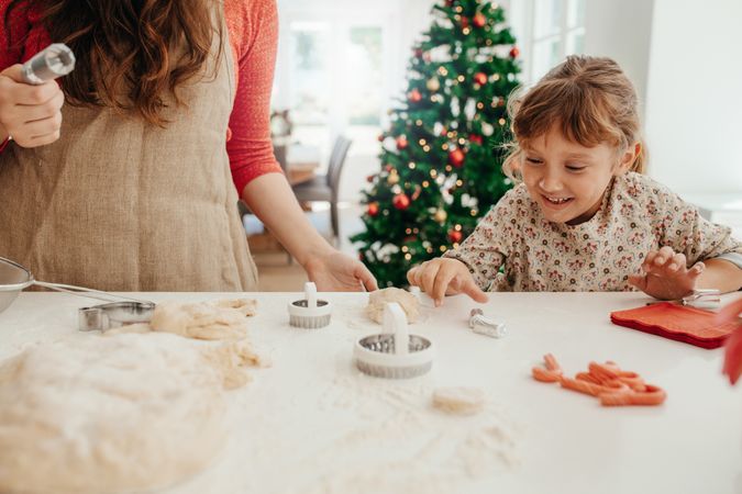 Mother and daughter making Christmas cookies