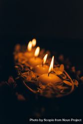 Diwali's lit diyas in dark room 5kK6G5